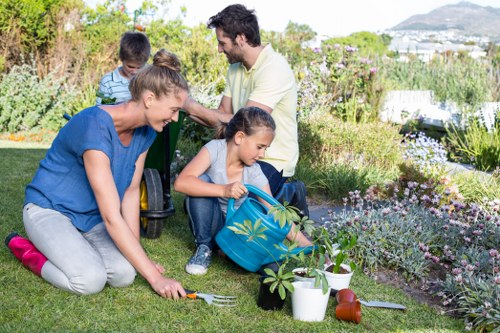 Experienced gardeners in Upminster Bridge working on a well-kept garden